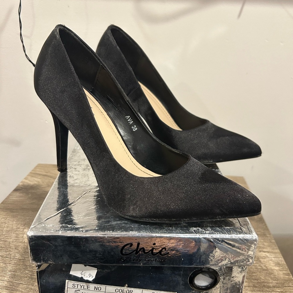 Black satin pumps